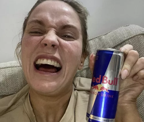 Vicky excitedly holds a can of Red Bull to get her through her all-nighter for Centrepoint