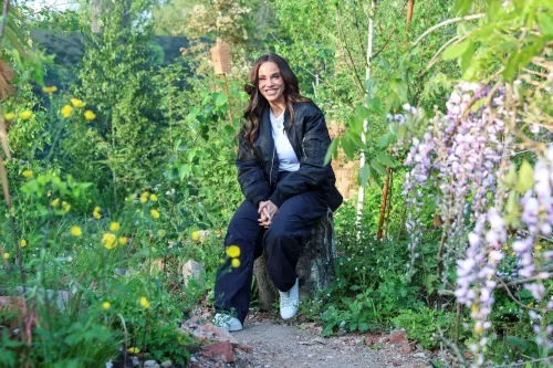 Vicky Pattison stands in the Centrepoint Garden surrounded by wildflowers on a sunny morning