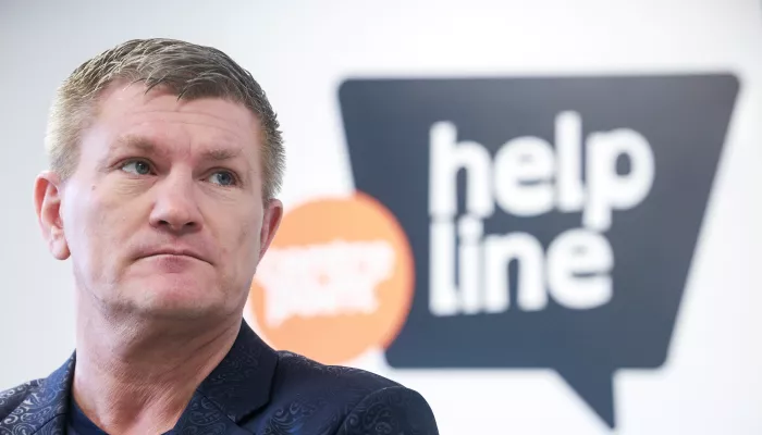 Ricky Hatton stands in front of the Centrepoint Helpline logo