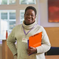 Centrepoint member of staff holding a clipboard