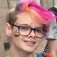 Young person with rainbow hair