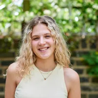 A young person smiling 