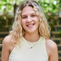 A young person smiling
