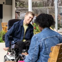 3 young people talking and smiling