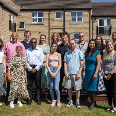 Group of cardfactory Foundation staff and Centrepoint staff stood together, happy and smiling.
