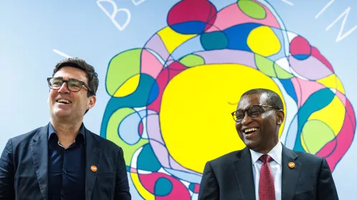 Picture shows Centrepoint CEO stood beside Manchester Mayor, Andy Burnham in front of colourful mural.