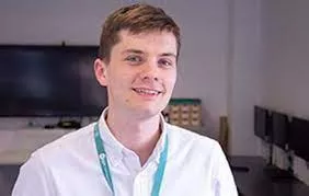 Photograph of Centrepoint's Billy Harding in an office setting