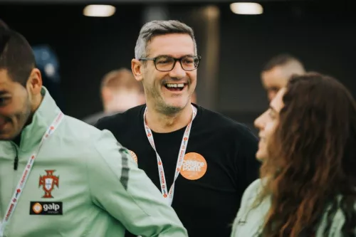 Photograph of Craig McManus, Senior Development Officer at Centrepoint smiling whilst coaching a football game