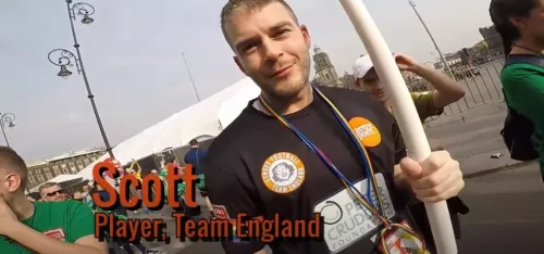 Video thumbnail image of Team England player Scott holding a flagpole