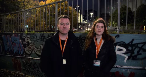 Two members of Centrepoint’s Rough Sleepers Initiative Team working at night to support homeless people on the streets