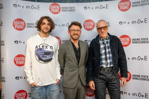 Ali Plumb (centre) standing with Daniel Day Lewis (right) and Ronan Day Lewis (left).