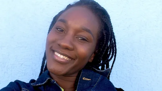 Young person smiling at the camera