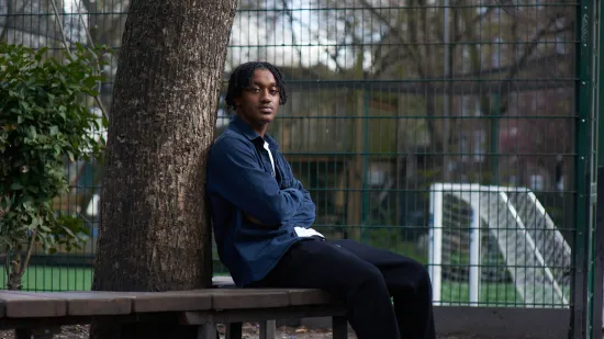A young person on a park bench