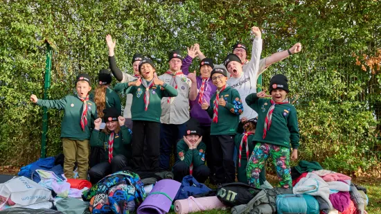 Cub group cheering with sleep out hats on