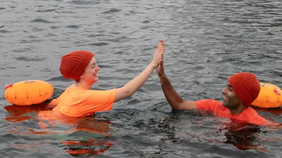 Two people dipping and high fiving