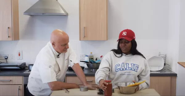 Aldo Zilli and a young person in a kitchen