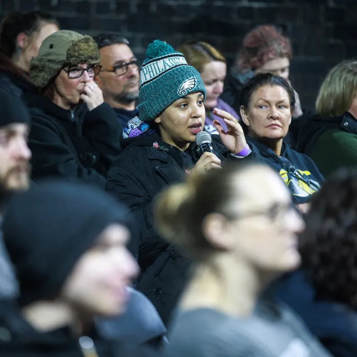 Crowd of participants at Sleep Out participating in a panel talk