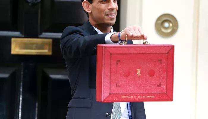 UK Minister, Rishi Sunak poses with chancellor's red box