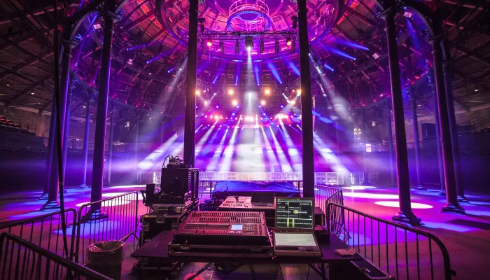 Photo of Camden Roundhouse main space lit up in purple lighting