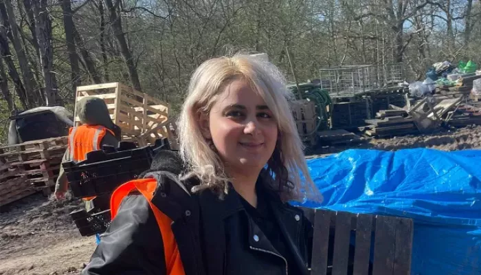 Young person outside in high vis