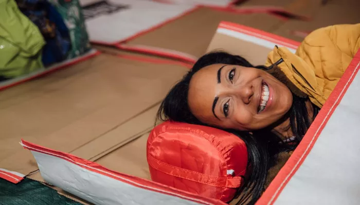 Person in sleeping bag taking part in Sleep Out