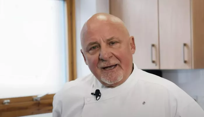 Aldo Zilli in white in a kitchen