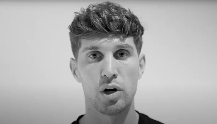 Black and white screenshot of footballer John Stones