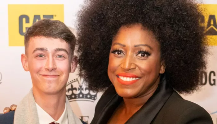 Mica Paris and award winner smiling at camera