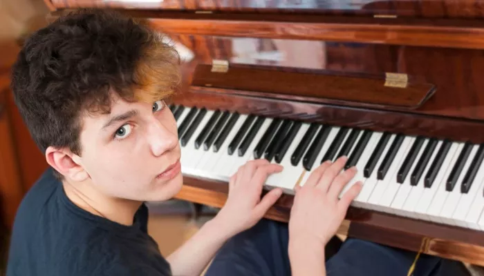 Young person playing the piano