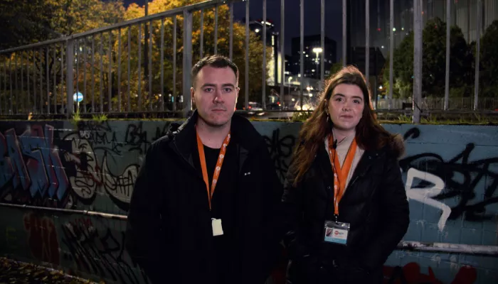 Two members of Centrepoint’s Rough Sleepers Initiative Team working at night to support homeless people on the streets