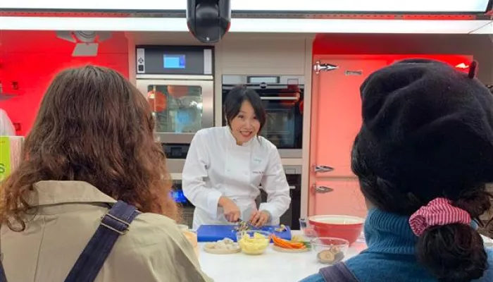 Ching He Huang makes dumplings with Centrepoint young people