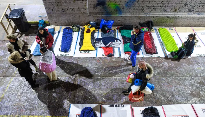 people set up their sleeping spaces
