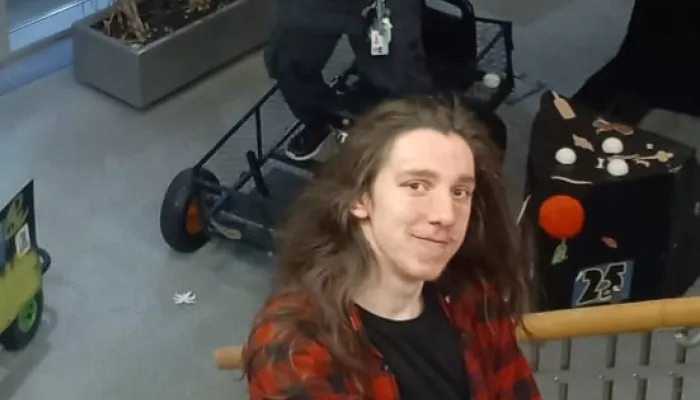 Young person smiling at camera