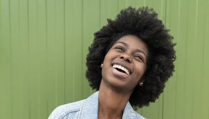 Young woman smiling and looking up