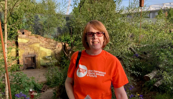 Woman smiling at camera in a garden