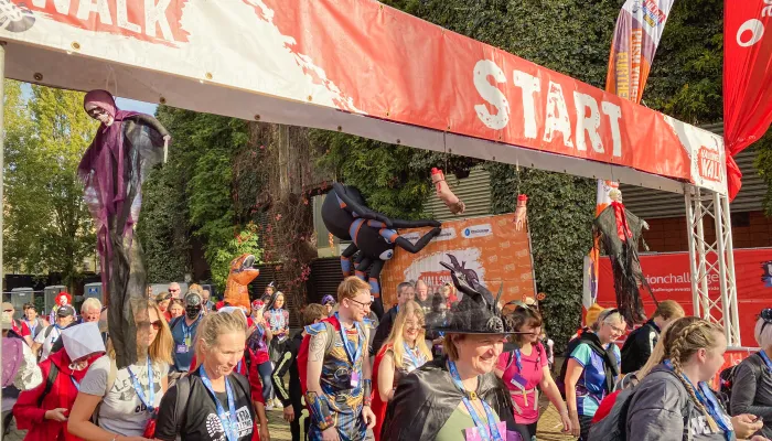 People in spooky fancy dress crossing the start line
