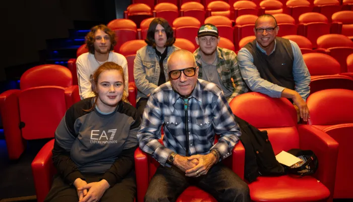 Daniel Day Lewis and Centrepoint young people in a movie theatre