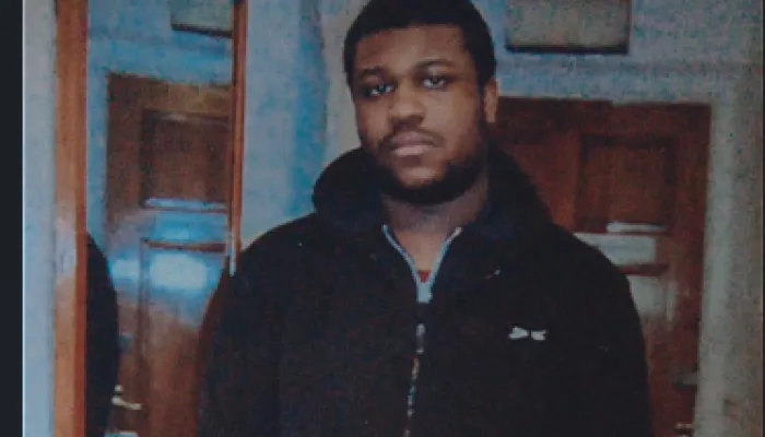 Young man wearing a black hoodie