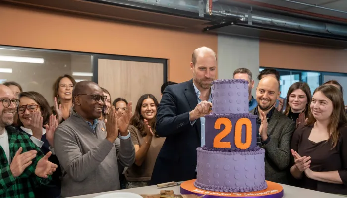 HRH Prince William cuts a big cake to celebrate the 20th anniversary