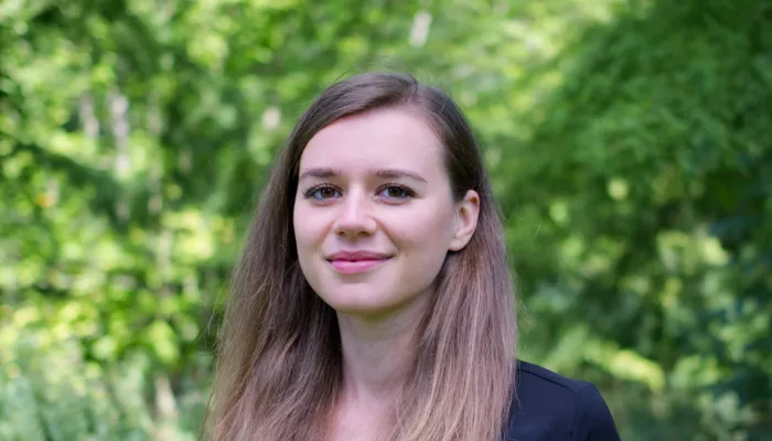 Young woman looking at camera and smiling