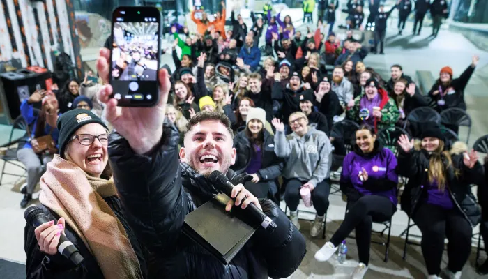 Dean McCullough takes a selfie with loads of happy Sleep Out participants in Manchester