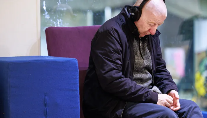 Sleep Out participant listening to headphones