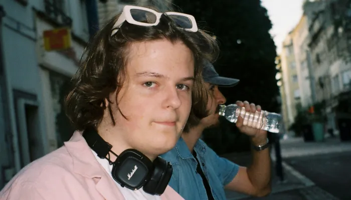 Young person in a pink shirt