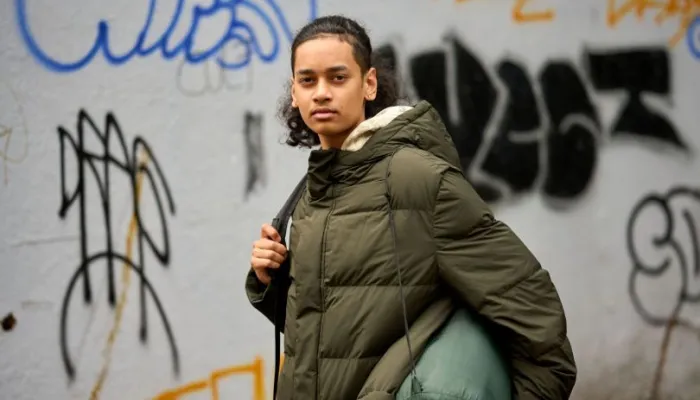 Young person in alleyway 