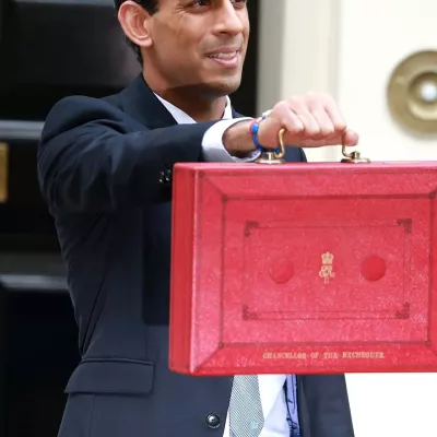 UK Minister, Rishi Sunak poses with chancellor's red box