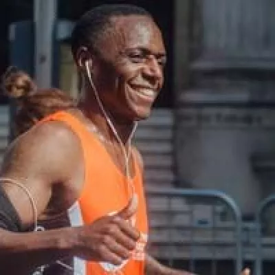 Person running with Centrepoint top and headphones