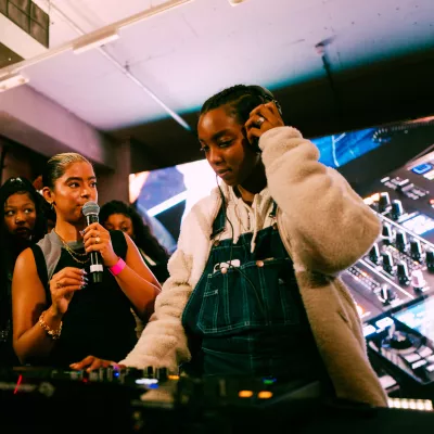 young person learning to DJ