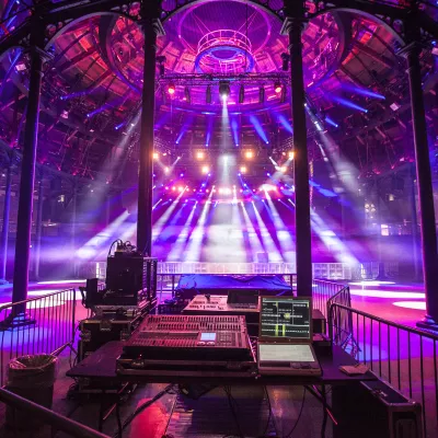 Photo of Camden Roundhouse main space lit up in purple lighting