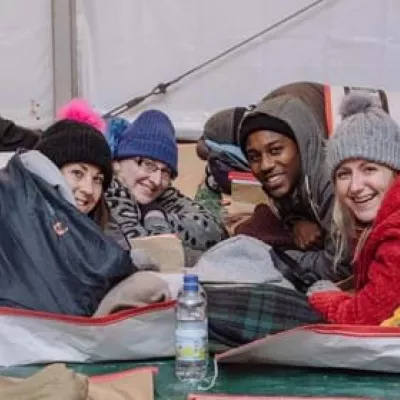 4 people lying sleeping bags for Sleep Out