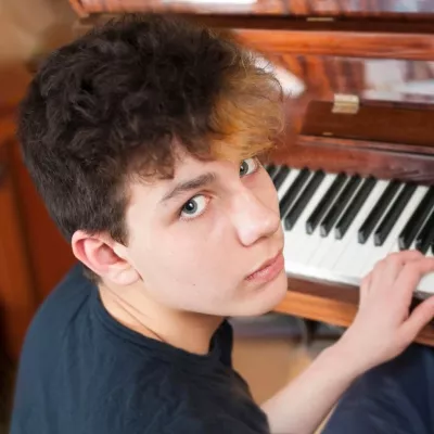 Young person playing the piano